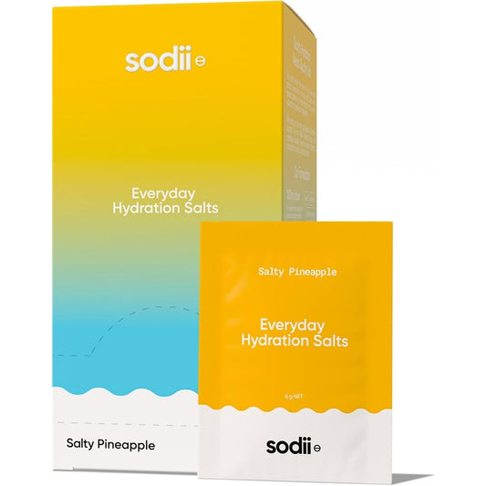Sodii Everyday Hydration Salts in Salty Pineapple flavor, showing the retail box and an individual sachet with a yellow-to-blue gradient design on a white background.