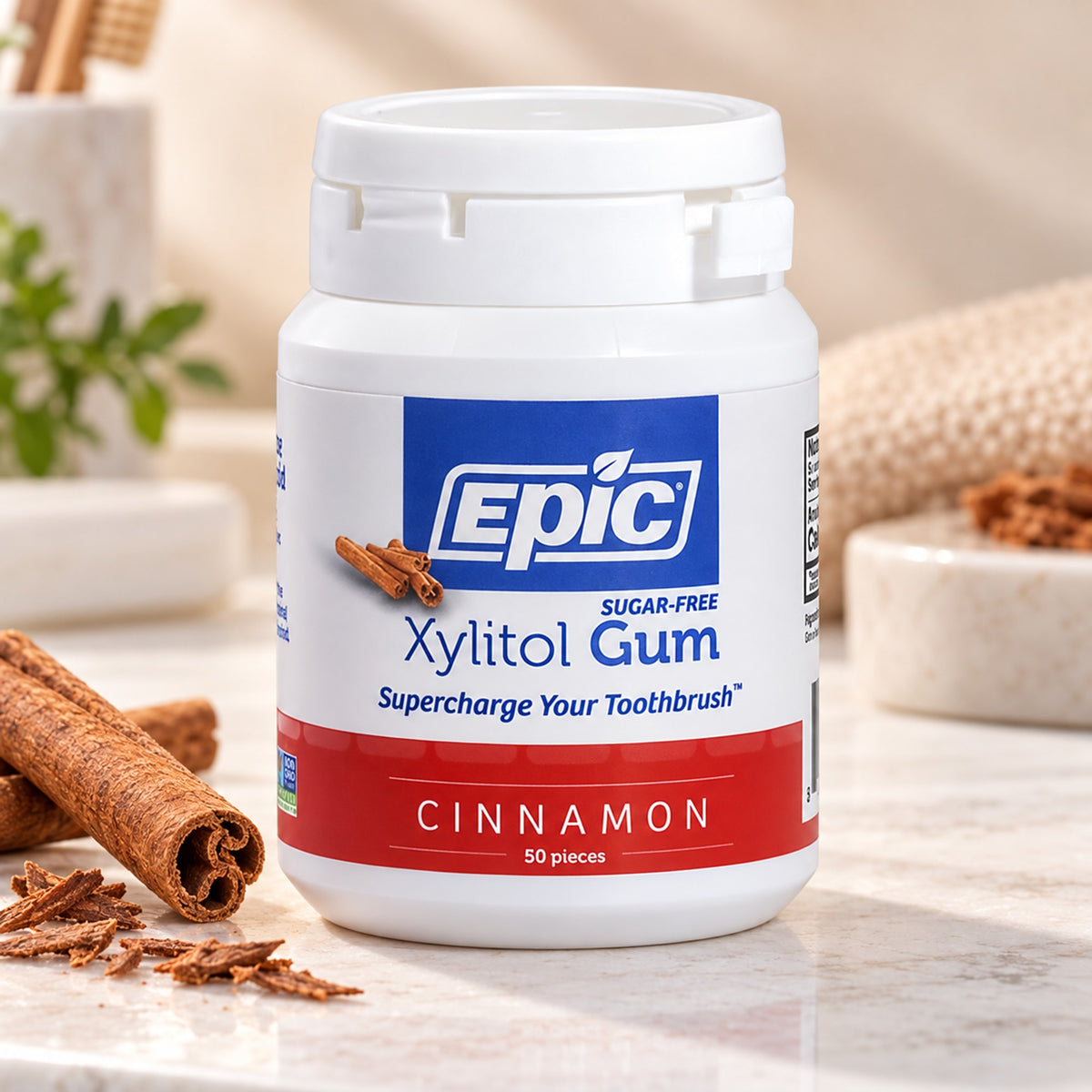 EPIC cinnamon xylitol chewing gum with cinnamon sticks in a clean oral care setting