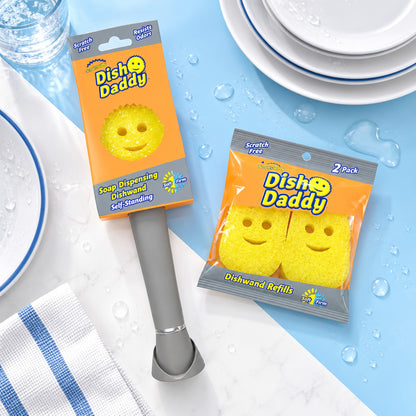 Scrub Daddy Dish Daddy dishwand and two-pack of yellow refill heads in a clean kitchen flat lay